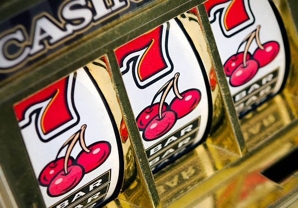 Mobile phone showing Top Trend Gaming slot game in landscape orientation with full interface